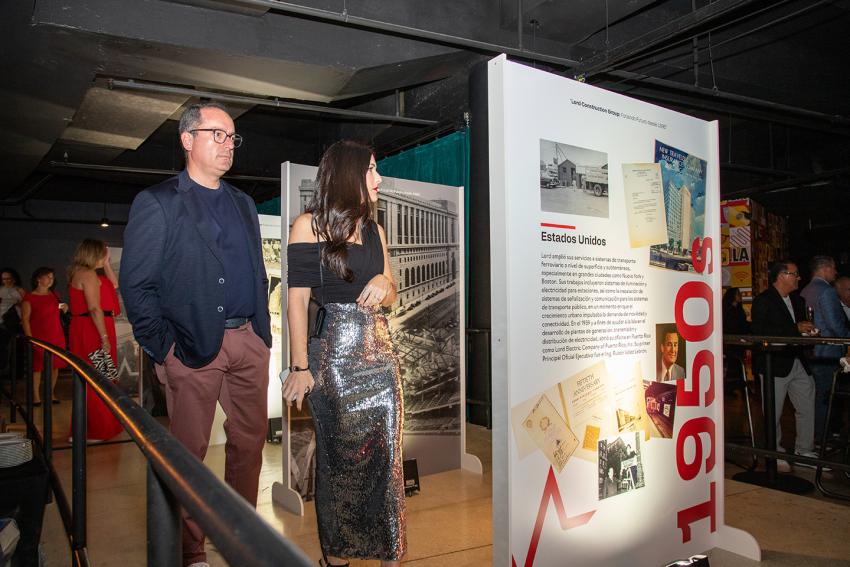 People walking through exhibit