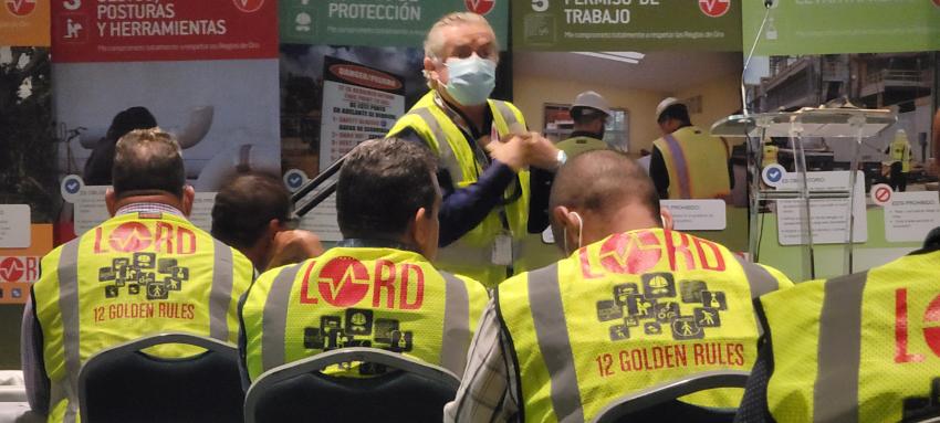Workers in high viz vests that say LORD