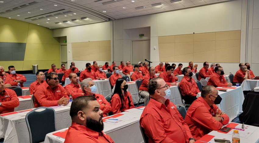 Workers listening to a presentation