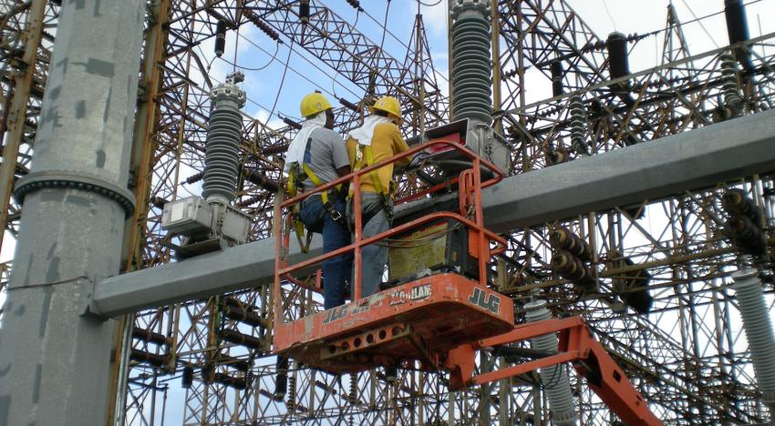Employees working with metal structure