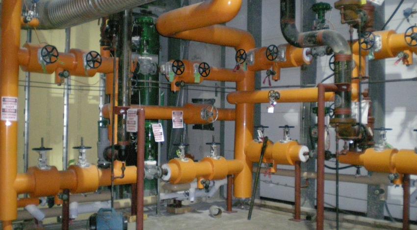 Room with industrial piping and valves