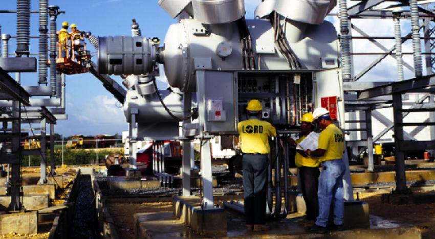 Employees with open electrical panel