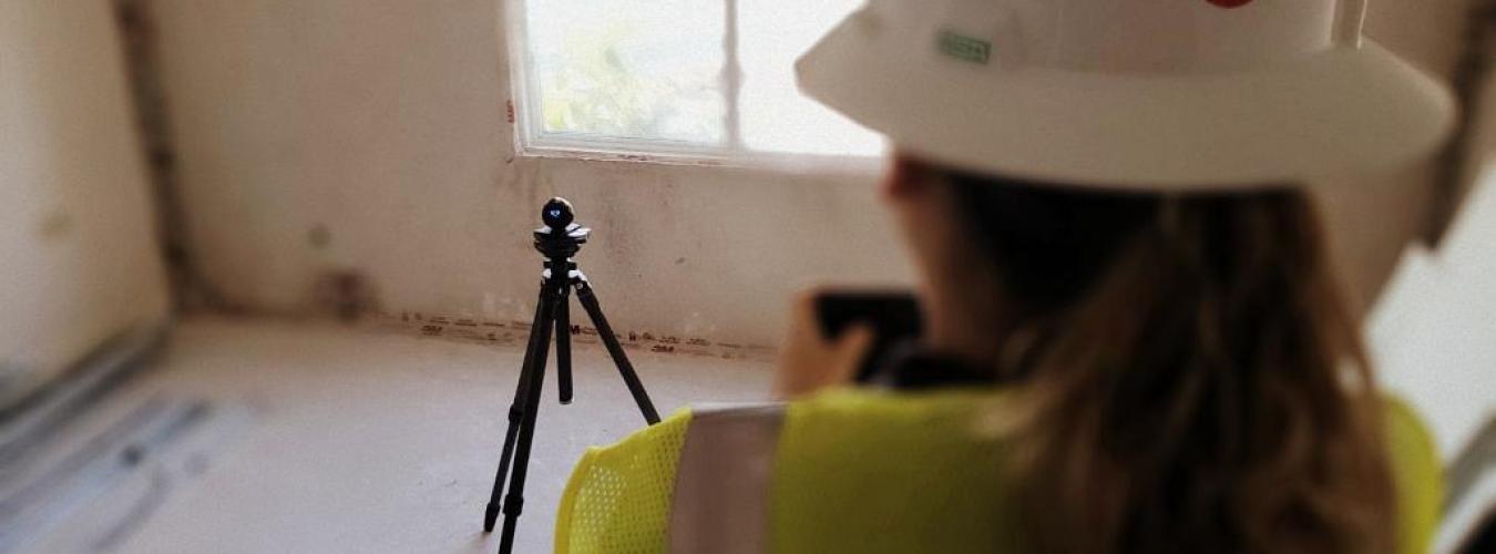 Woman in Hardhat Surveying