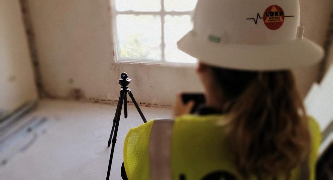 Woman in Hardhat Surveying