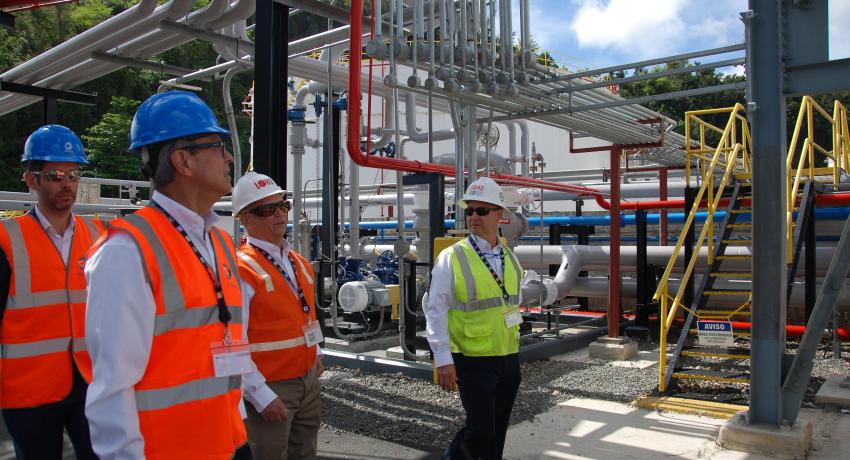 Constuction workers inspecting piping installation